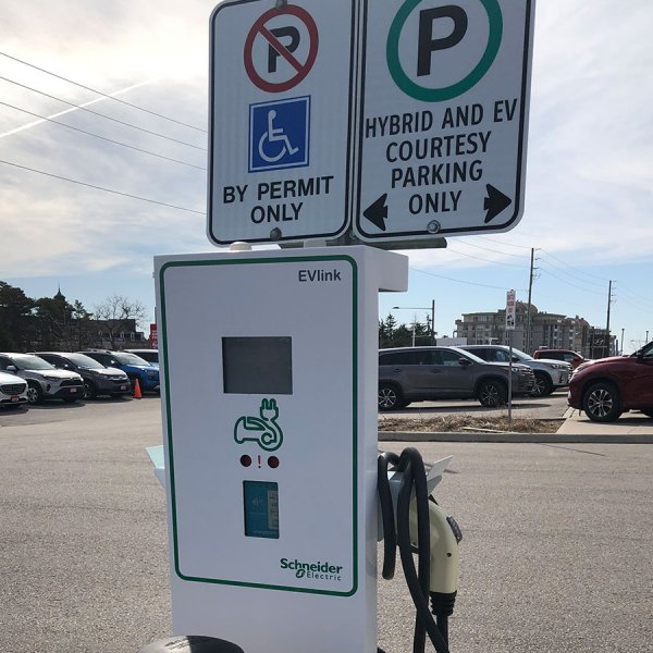 ev-charger-stand-green-front-toronto-outdoor-advance-net-electric